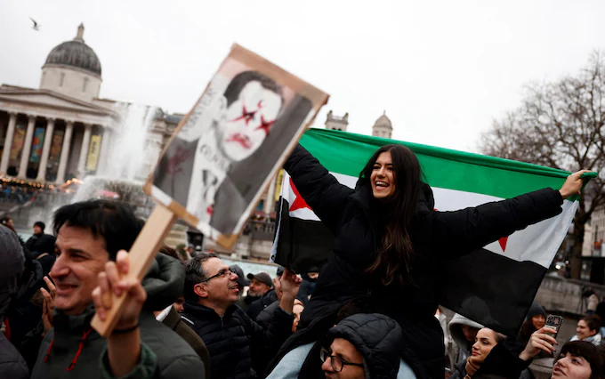 Syrian crowd cheer the downfall of Bashar al-Assad